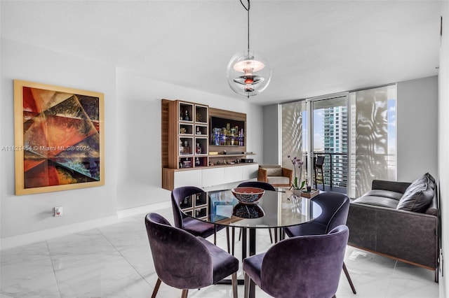 325 S Biscayne Blvd Unit 2515, Miami, FL 33131 - dining room featuring light marble finish floors and floor to ceiling windows