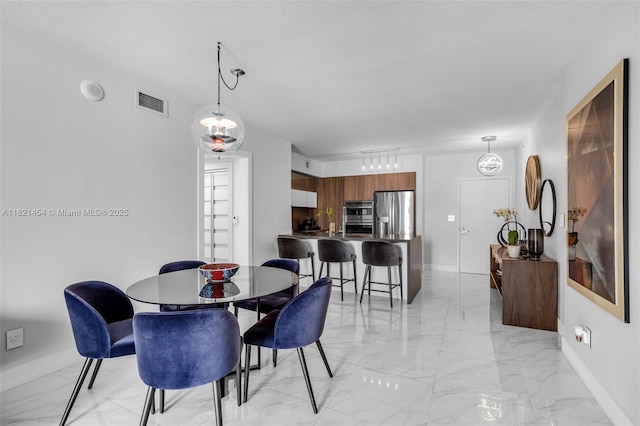 325 S Biscayne Blvd Unit 2515, Miami, FL 33131 - dining room with light marble finish floors and baseboards