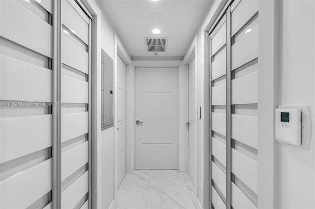 325 S Biscayne Blvd Unit 2515, Miami, FL 33131 - hallway with light marble finish floors, a package area, and recessed lighting