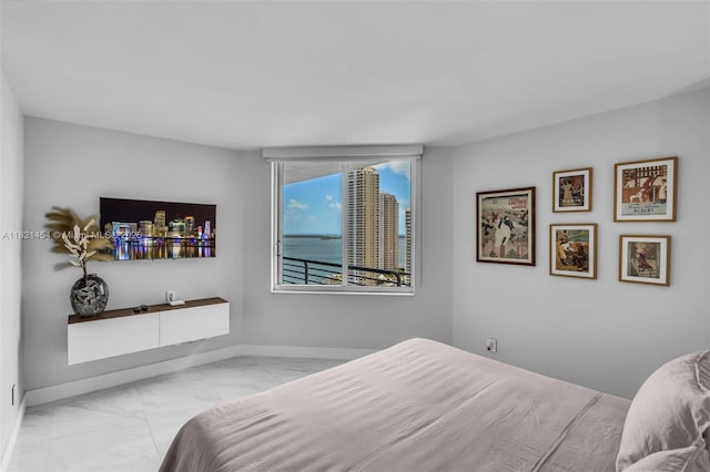 325 S Biscayne Blvd Unit 2515, Miami, FL 33131 - bedroom with marble look tile flooring and baseboards