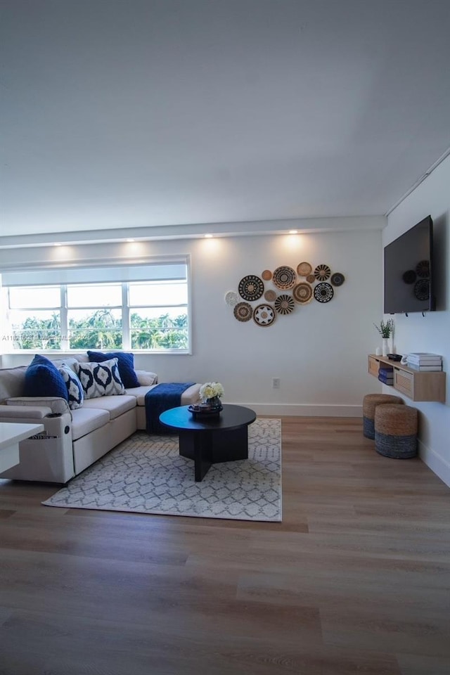 7904 W Dr Unit 501, North Bay Village, FL 33141 - living room featuring wood finished floors and baseboards