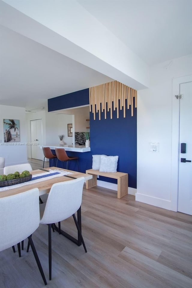 7904 W Dr Unit 501, North Bay Village, FL 33141 - dining area featuring wood finished floors and baseboards