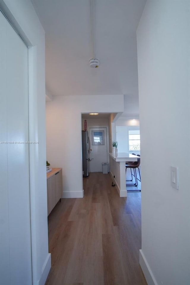 7904 W Dr Unit 501, North Bay Village, FL 33141 - corridor with light wood-style flooring and baseboards