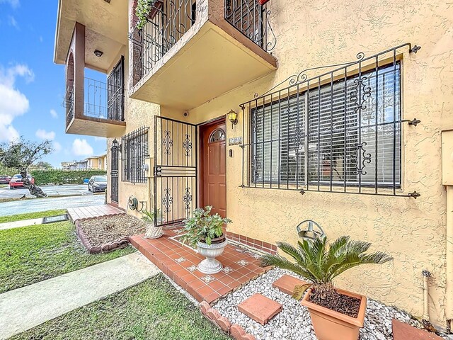1782 W 42nd St Unit 1782, Hialeah, FL 33012 - view of exterior entry featuring stucco siding