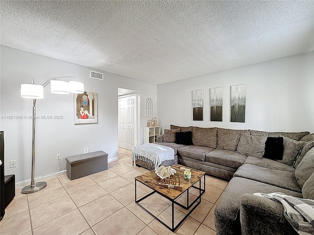 1782 W 42nd St Unit 1782, Hialeah, FL 33012 - living area featuring light tile patterned floors and a textured ceiling
