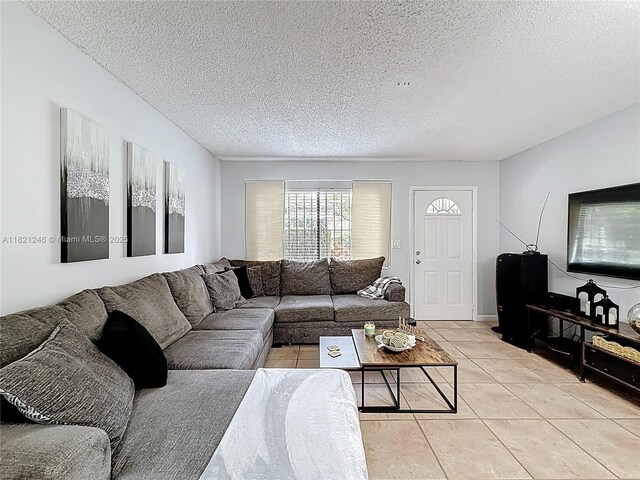 1782 W 42nd St Unit 1782, Hialeah, FL 33012 - living room with light tile patterned flooring and a textured ceiling