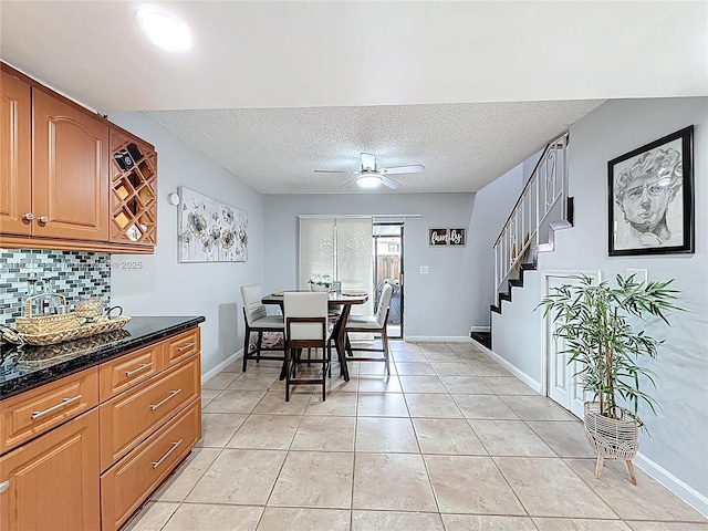 1782 W 42nd St Unit 1782, Hialeah, FL 33012 - dining area featuring stairs, ceiling fan, a textured ceiling, and light tile patterned floors