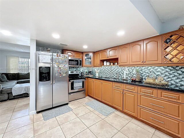 1782 W 42nd St Unit 1782, Hialeah, FL 33012 - kitchen featuring stainless steel appliances, decorative backsplash, light tile patterned floors, and recessed lighting