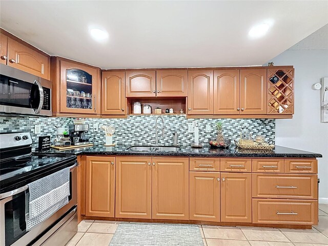 1782 W 42nd St Unit 1782, Hialeah, FL 33012 - kitchen featuring appliances with stainless steel finishes, dark stone counters, and light tile patterned floors