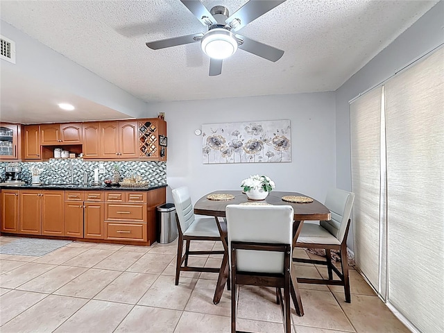 1782 W 42nd St Unit 1782, Hialeah, FL 33012 - dining room with a textured ceiling, a ceiling fan, and light tile patterned flooring