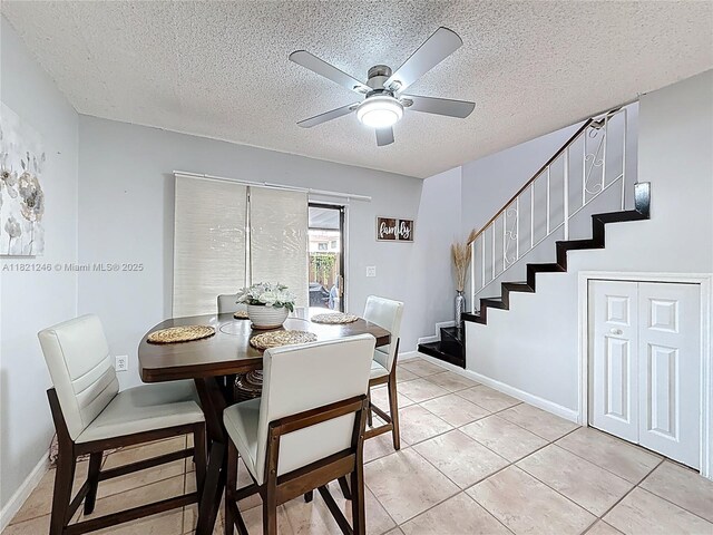 1782 W 42nd St Unit 1782, Hialeah, FL 33012 - dining room featuring stairs, a textured ceiling, ceiling fan, and light tile patterned floors