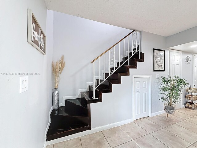 1782 W 42nd St Unit 1782, Hialeah, FL 33012 - stairway featuring tile patterned flooring and a textured ceiling
