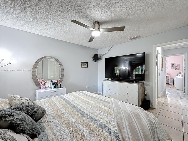 1782 W 42nd St Unit 1782, Hialeah, FL 33012 - bedroom featuring light tile patterned floors, a textured ceiling, and ceiling fan