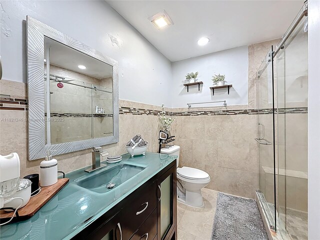 1782 W 42nd St Unit 1782, Hialeah, FL 33012 - full bath with tile walls, vanity, a shower stall, and a wainscoted wall