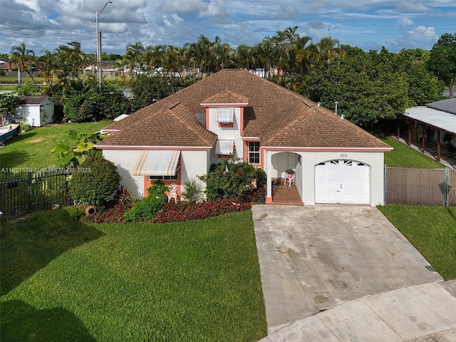 18033 SW 137th Ct, Miami, FL 33177 - view of front of home featuring roof with shingles, a garage, driveway, and stucco siding