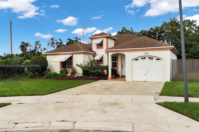 18033 SW 137th Ct, Miami, FL 33177 - view of front of home featuring stucco siding, concrete driveway, an attached garage, and roof with shingles