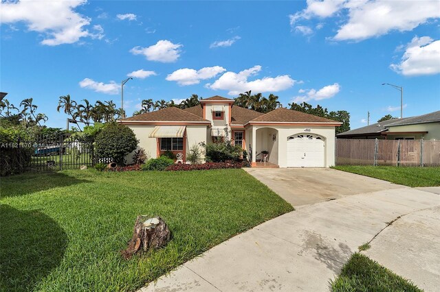18033 SW 137th Ct, Miami, FL 33177 - mediterranean / spanish-style house featuring stucco siding, an attached garage, and driveway