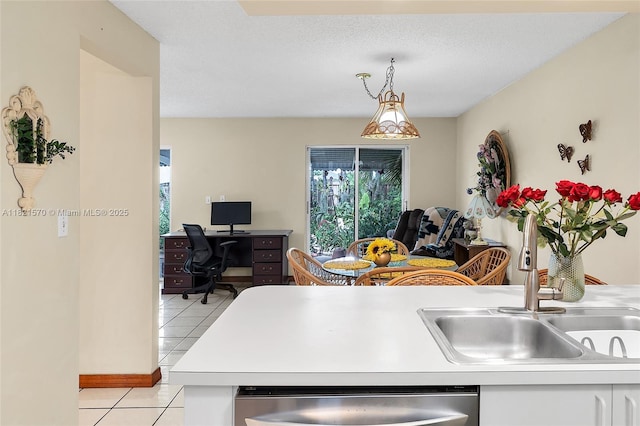 18033 SW 137th Ct, Miami, FL 33177 - kitchen with light tile patterned floors, stainless steel dishwasher, light countertops, white cabinets, and an office area