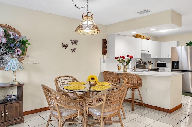 18033 SW 137th Ct, Miami, FL 33177 - dining area featuring baseboards and light tile patterned flooring