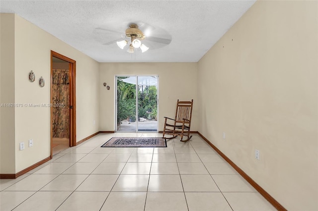 18033 SW 137th Ct, Miami, FL 33177 - empty room featuring a ceiling fan, a textured ceiling, and light tile patterned floors