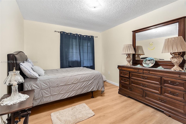 18033 SW 137th Ct, Miami, FL 33177 - bedroom with light wood-type flooring and a textured ceiling
