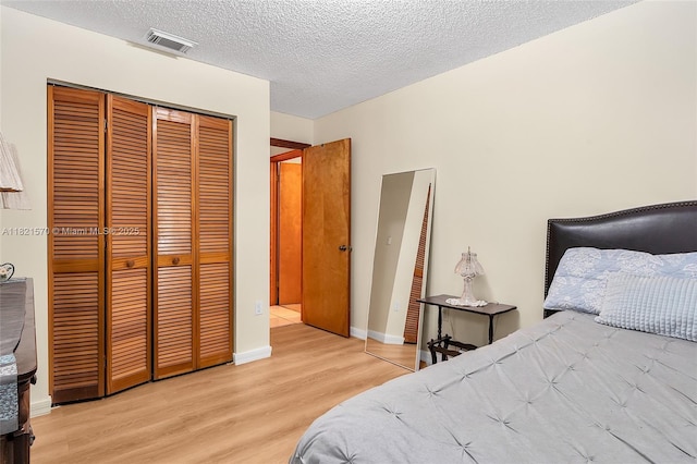 18033 SW 137th Ct, Miami, FL 33177 - bedroom with wood finished floors, a closet, and a textured ceiling