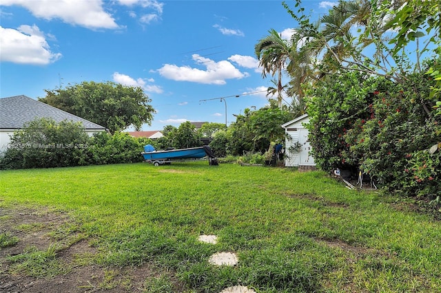 18033 SW 137th Ct, Miami, FL 33177 - view of green lawn featuring a storage unit