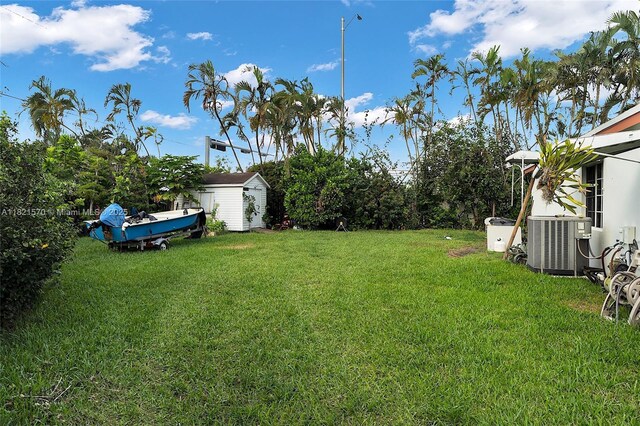 18033 SW 137th Ct, Miami, FL 33177 - view of green lawn with a storage shed