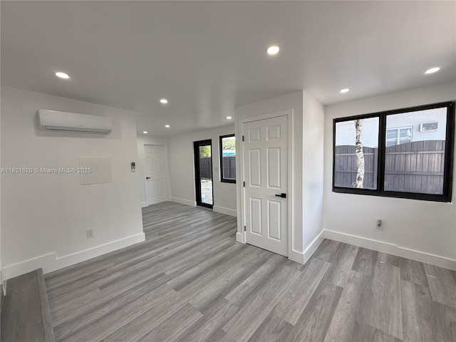 240 SW 55th Ave, Miami, FL 33134 - unfurnished room featuring an AC wall unit, recessed lighting, and wood finished floors