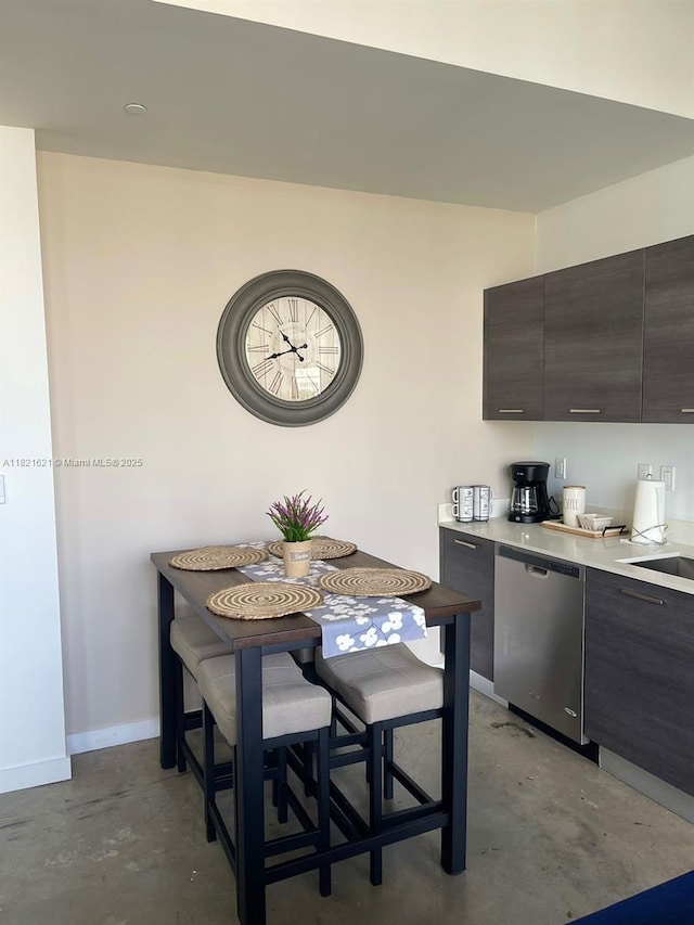 151 SE 1st St Unit 2406, Miami, FL 33131 - dining space featuring concrete flooring and baseboards
