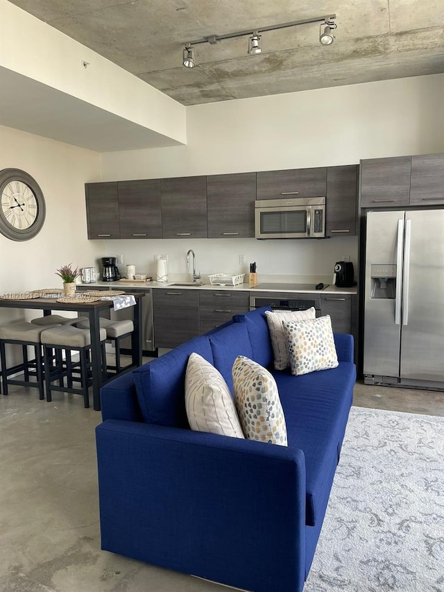 151 SE 1st St Unit 2406, Miami, FL 33131 - living area with concrete flooring and track lighting