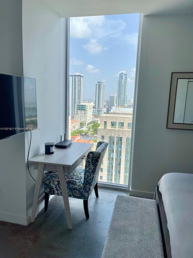 151 SE 1st St Unit 2406, Miami, FL 33131 - office area with a city view and finished concrete floors