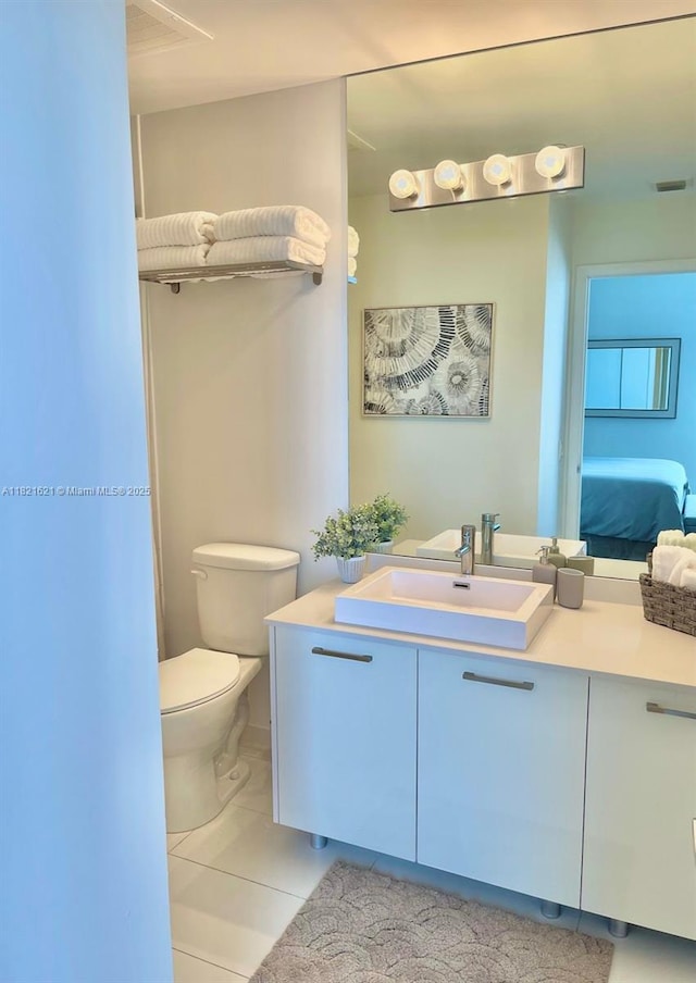 151 SE 1st St Unit 2406, Miami, FL 33131 - ensuite bathroom with vanity and tile patterned floors