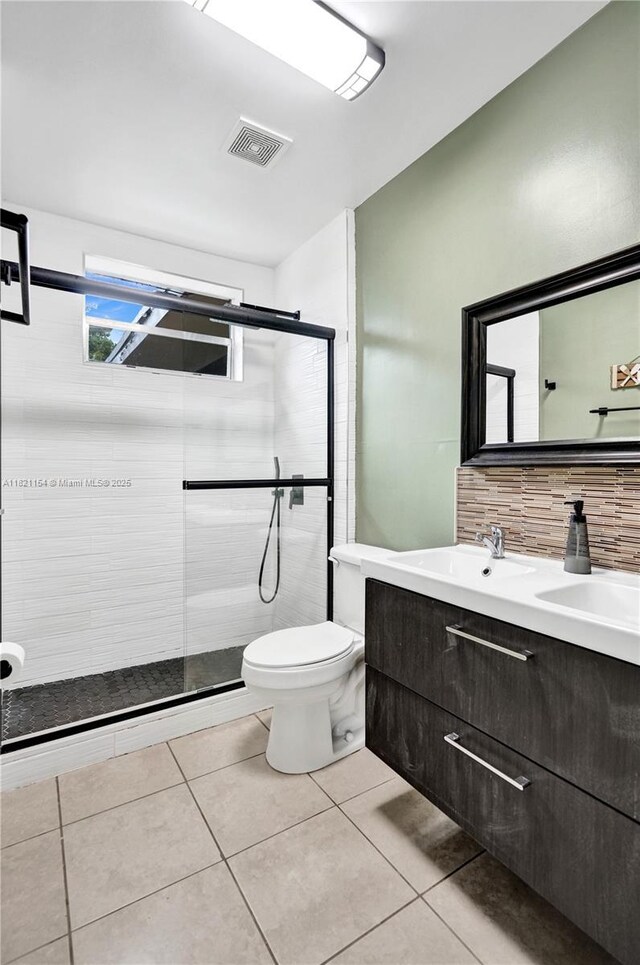 2041 Arcadia Dr, Miramar, FL 33023 - full bath with double vanity, a stall shower, tile patterned floors, and tasteful backsplash