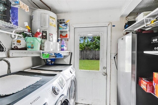 2041 Arcadia Dr, Miramar, FL 33023 - laundry room featuring independent washer and dryer
