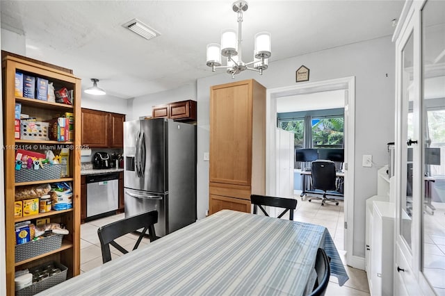 2041 Arcadia Dr, Miramar, FL 33023 - kitchen with appliances with stainless steel finishes, light tile patterned floors, a chandelier, a desk, and open shelves