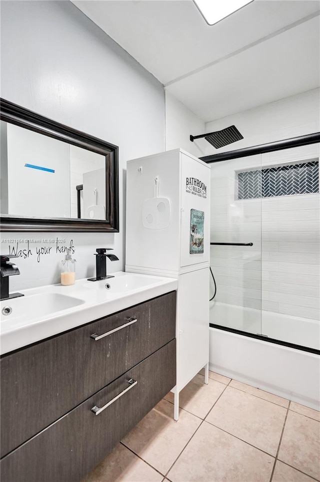 2041 Arcadia Dr, Miramar, FL 33023 - bathroom featuring bath / shower combo with glass door, double vanity, and tile patterned flooring