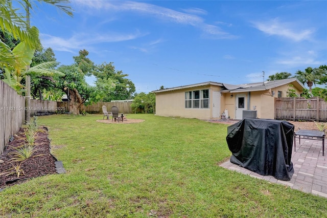 2041 Arcadia Dr, Miramar, FL 33023 - fenced backyard featuring a patio and a fire pit