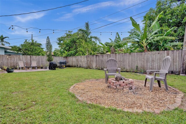 2041 Arcadia Dr, Miramar, FL 33023 - fenced backyard featuring an outdoor fire pit