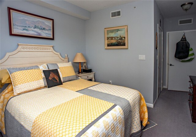 bedroom with carpet floors and baseboards
