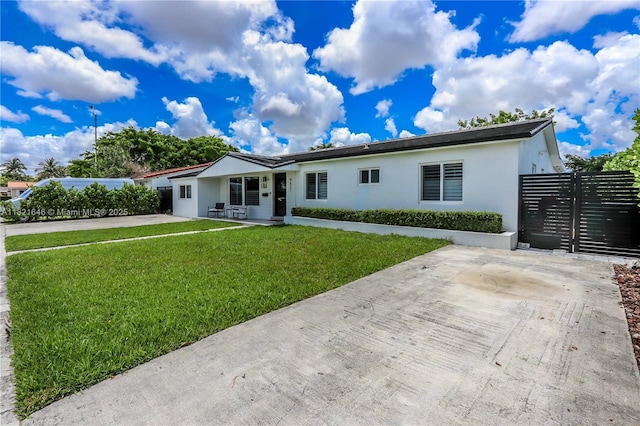 9627 SW 18th Ter, Miami, FL 33165 - single story home with stucco siding and a patio area
