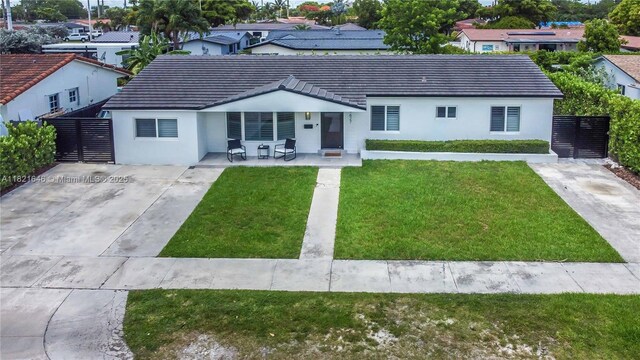 9627 SW 18th Ter, Miami, FL 33165 - single story home with stucco siding, a front yard, and a porch