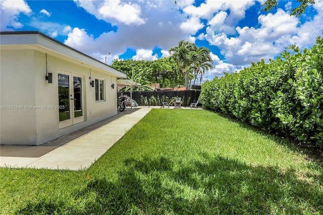9627 SW 18th Ter, Miami, FL 33165 - view of yard featuring french doors and a patio
