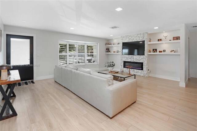 9627 SW 18th Ter, Miami, FL 33165 - living room featuring light wood finished floors and recessed lighting