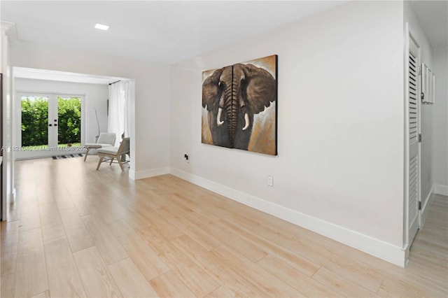 9627 SW 18th Ter, Miami, FL 33165 - spare room featuring light wood finished floors and french doors