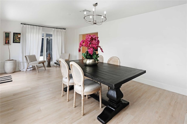 9627 SW 18th Ter, Miami, FL 33165 - dining area with a chandelier and light wood-style flooring