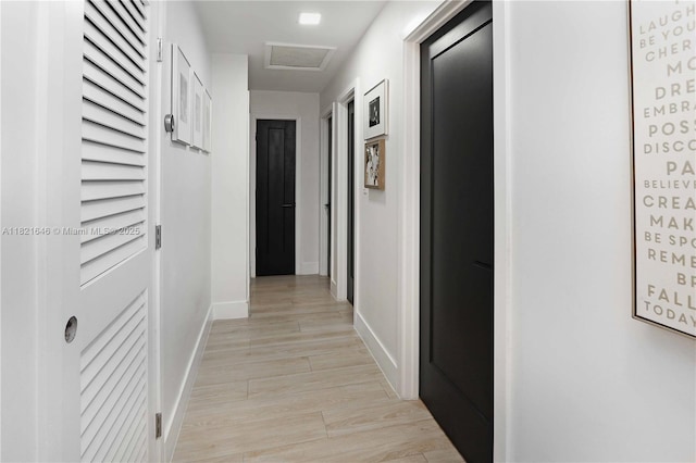 9627 SW 18th Ter, Miami, FL 33165 - hallway with attic access and light wood-type flooring