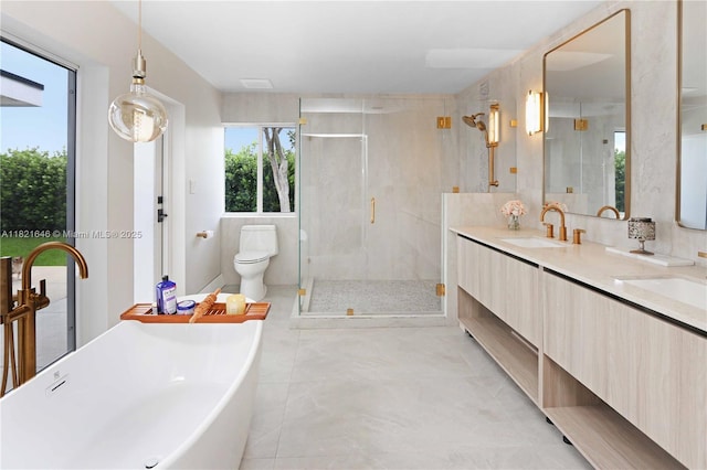 9627 SW 18th Ter, Miami, FL 33165 - bathroom featuring a soaking tub, double vanity, a stall shower, and tile patterned floors