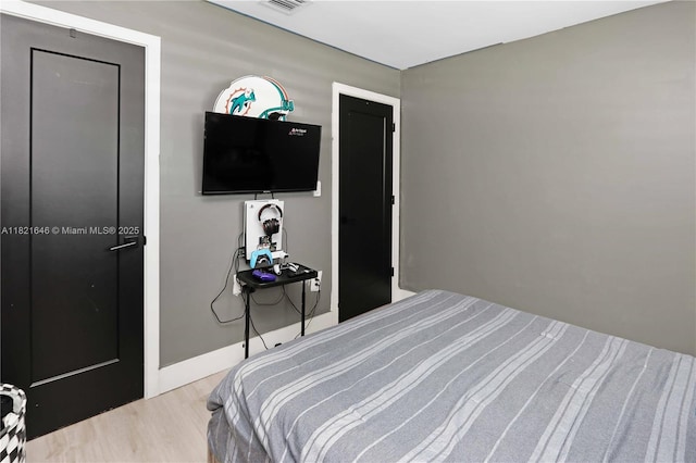 9627 SW 18th Ter, Miami, FL 33165 - bedroom featuring wood finished floors and baseboards