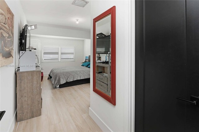 9627 SW 18th Ter, Miami, FL 33165 - bedroom with light wood-style floors